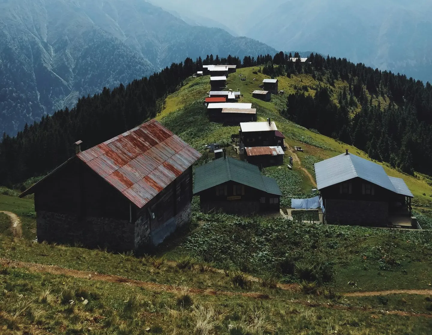 wide angle photography of buildings near mountain during daytime